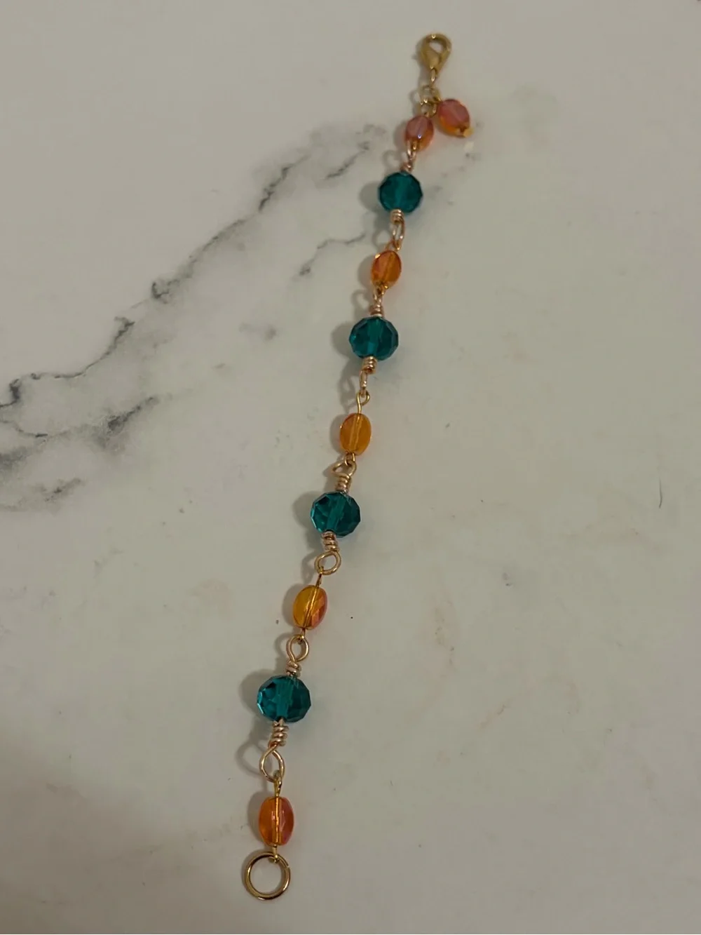 Wired wrap Teal Crystal and Orange Glass Bracelet